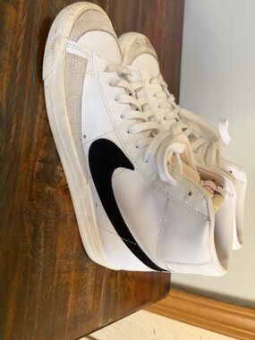 Nike White High-Top Sneakers with Black Swoosh